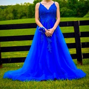 My prom dress it’s a size 00, Royal blue with gem flowers on top!